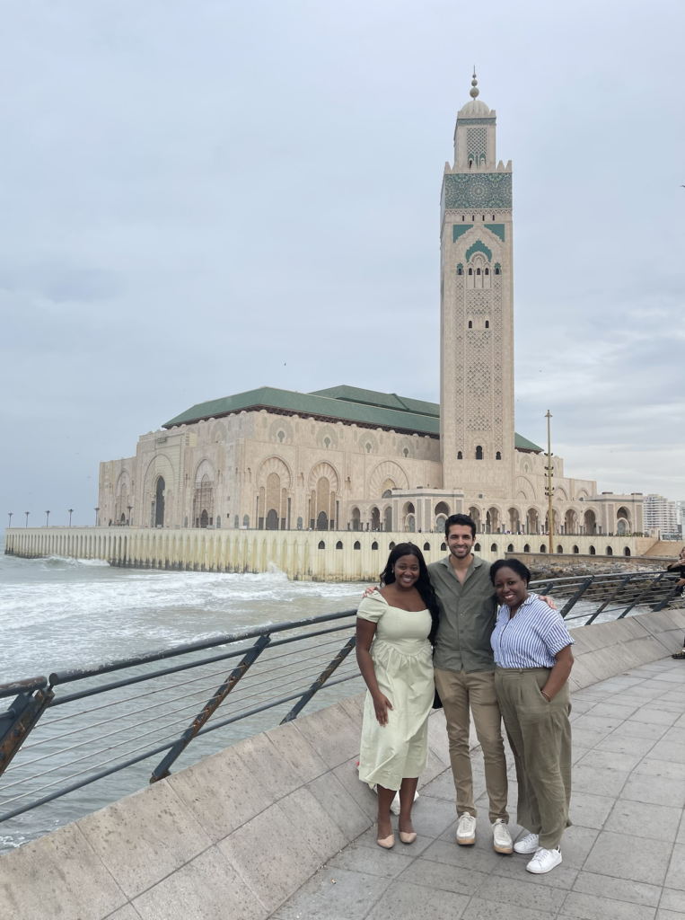 two students and clinician stand outside in Morocco